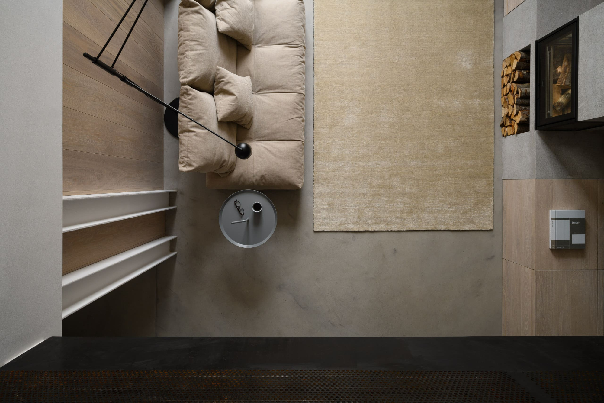 Soft beige sofa with black floor lamp in modern living room, minimalist decor, and neutral tones.