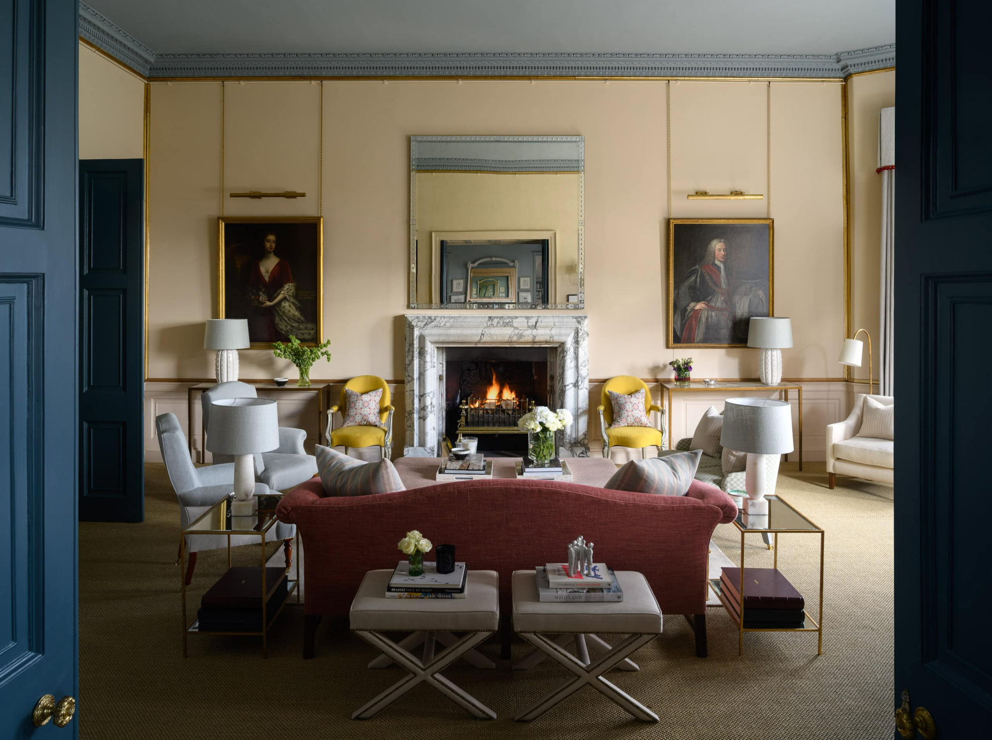 Elegant living room with classic decor, fireplace, and luxurious seating arrangements.